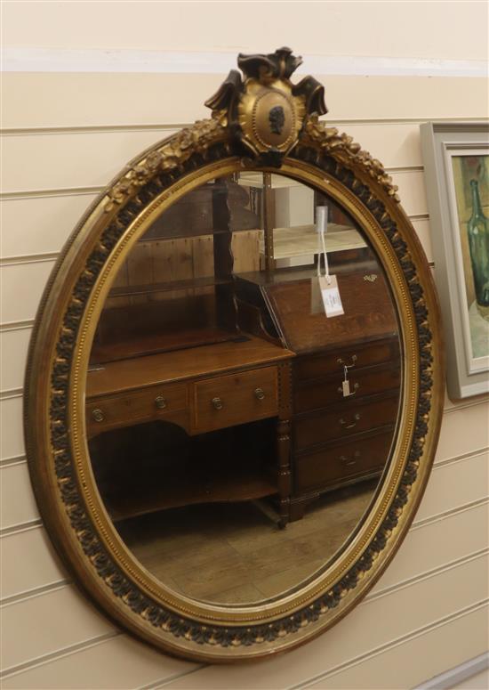 A 19th century French giltwood and gesso oval wall mirror H.100cm